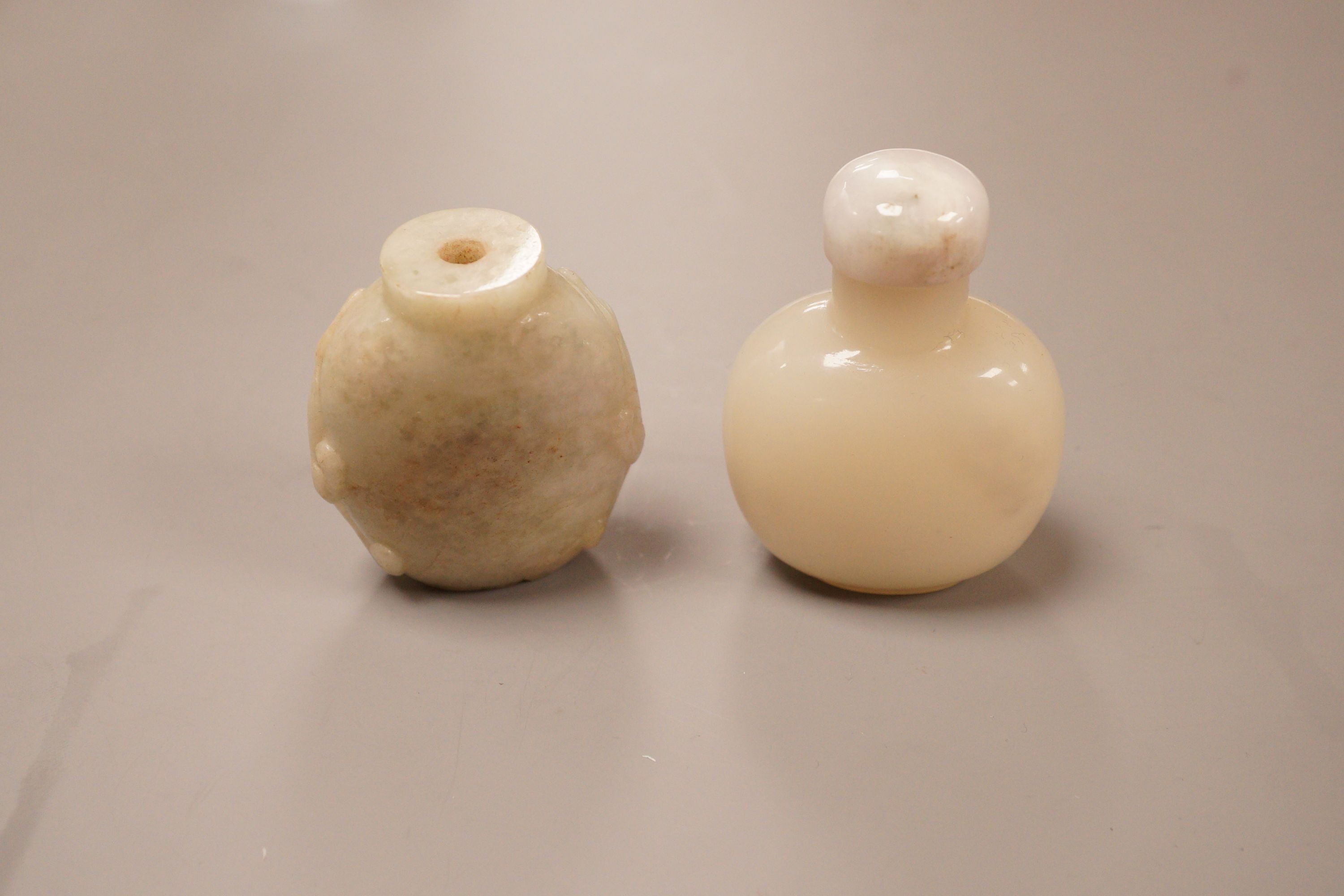 A Chinese jadeite snuff bottle and a glass snuff bottle